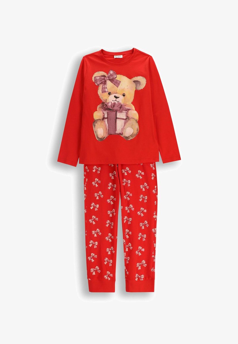 Czerwone piżamy z długim rękawem, na bluzce miś trzymający prezent, oraz czerwone spodnie w białe i różowe kokardki.