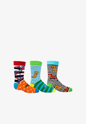 Three colorful children's socks with dinosaur patterns; one with red and blue, one with green and blue stripes, and one black and white striped.