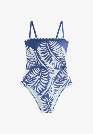 Kék-fehér egyrészes fürdőruha állítható vállpántokkal és nagy trópusi levélmintával.