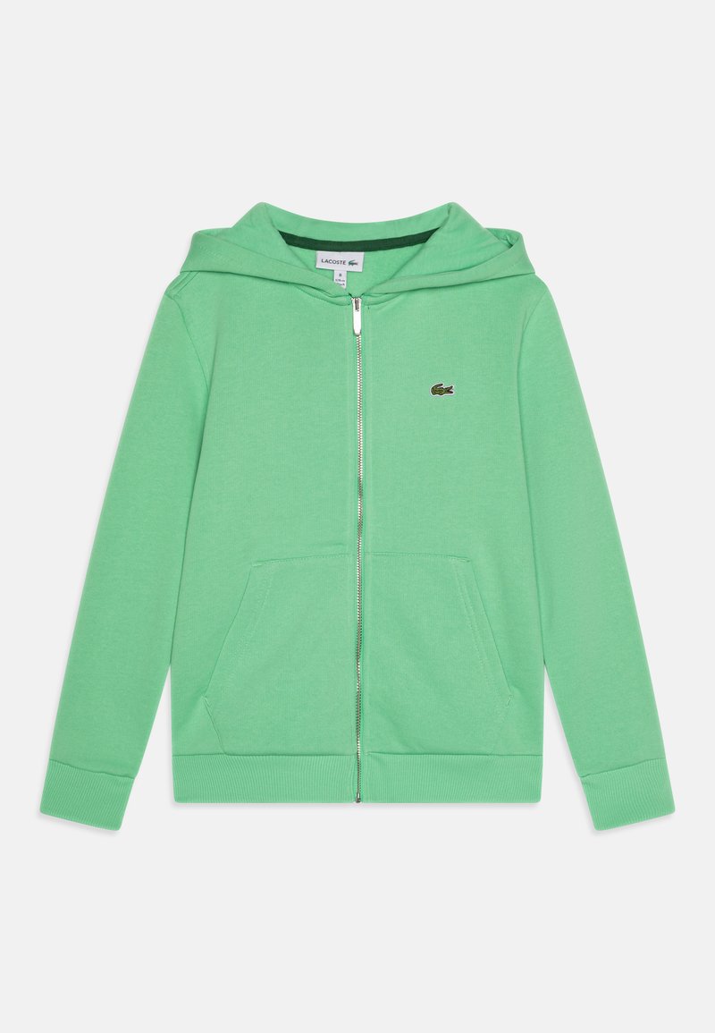 Haut à capuche zippé vert en coton doux. Comprend une poche kangourou, des poignets côtelés et une fermeture éclair à l'avant. Petit logo sur la poitrine.