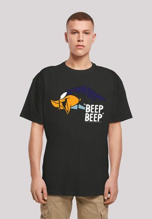 Black cotton t-shirt featuring a graphic of a cartoon character's face, with "BEEP BEEP" text in white. Short sleeves and relaxed fit.