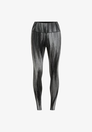 Leggings a fantasia nera e grigia con vita alta, realizzati in materiale elastico. Presentano strisce verticali e una texture liscia.