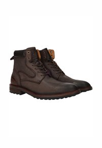Bruine leren enkelboots met een gestructureerd oppervlak, vetersluiting en contrasterende tan accenten bij de enkel. Rubberen zool met een goede grip.