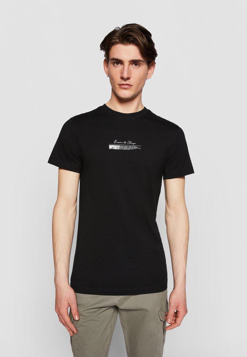 Black cotton t-shirt featuring short sleeves and a crew neckline, with white text graphics on the front.