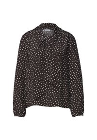 Blouse noire à manches longues avec des pois blancs et un détail de nœud papillon noué au col.