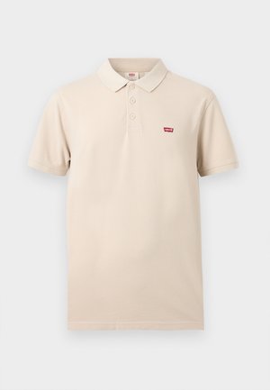 Polo beige a manica corta con tre bottoni e piccolo logo rosso Levi's sul petto sinistro.