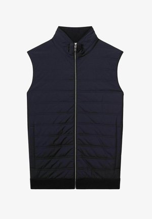 Marineblaues ärmelloses Vest mit hohem Kragen, Frontreißverschluss, gesteppter Textur und schwarzem geripptem Saum. Mit horizontalen Nähdetails.