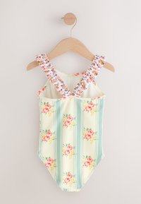 Enodelni kopalke s cvetličnim potiskom, svetlo zelenimi črtami, rožnatimi vrtnicami in nabranimi naramnicami. Iz mehke, teksturirane tkanine.