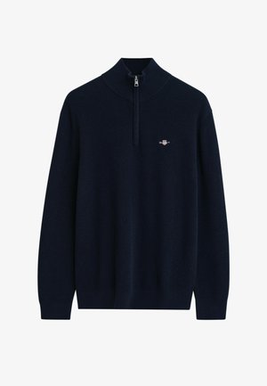 Maglione a coste in blu navy con maniche lunghe, collo a zip a un quarto e piccolo logo ricamato sul lato sinistro del petto.