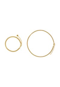 Set di bracciale e collana in tono dorato. Il bracciale ha un design rotondo con una chiusura sicura, mentre la collana presenta una curva leggermente più lunga.