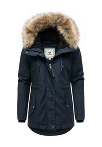 Navy blue parka coat featuring a fur-lined hood, zip and snap closure, two front pockets, and ribbed cuffs. Soft texture and practical design.