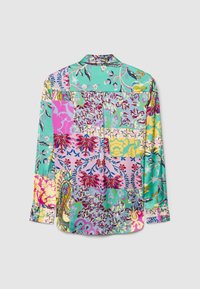 Long-sleeve shirt featuring a patchwork design in turquoise, pink, yellow, and green floral patterns, with a classic collar and buttoned cuffs.
