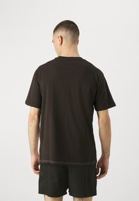 Puma POWER  - Camiseta estampada - black