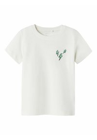 T-shirt bianco in cotone a maniche corte, con un motivo a zig-zag verde nella zona sinistra del petto. Texture liscia, scollo rotondo.