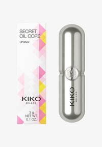 KIKO Milano Secret Oil Core lip balm with silver capsule-shaped tube and white box featuring pink and yellow geometric accents.
