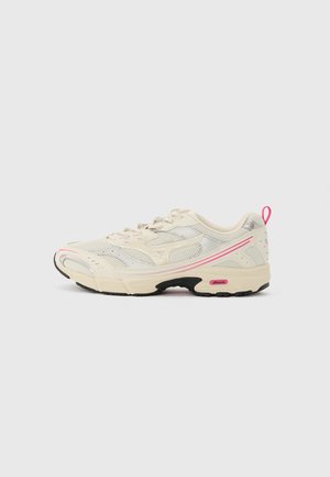 Cream and pink athletic sneaker with mesh upper, lace-up closure, black sole accents, and pink pull tab at heel.