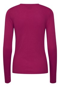 Bluzka z długim rękawem w jaskrawym różowym kolorze, wykonana z gładkiego, elastycznego materiału. Posiada prosty, okrągły dekolt i ściągacze przy rękawach. Bez wzorów i ozdób.