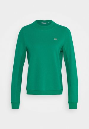 Sweat-shirt vert à manches longues avec col rond, poignets et ourlet côtelés, avec un petit logo crocodile brodé sur le côté gauche de la poitrine.