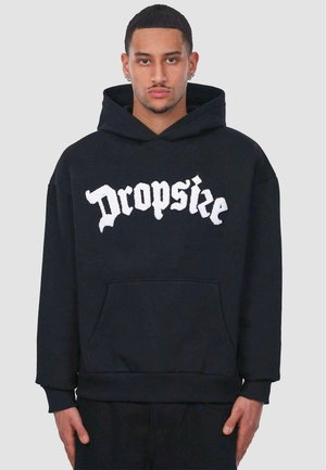 Black hoodie with front pocket and ribbed hem. Features white textured logo "Dropsize" in bold, gothic font across the chest.