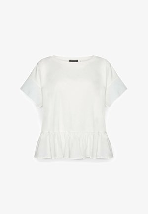 Blusa blanca de algodón con manga corta, escote redondo y detalle de volante en el bajo.