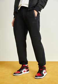 Nike Sportswear TECH FLEECE OPEN HEM PANT - Träningsbyxor - black