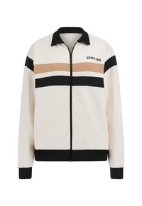 Zip-up jakna u boji krem, s crnim i bež horizontalnim prugama. Mekana tkanina, rebrasti ovratnik i manžetne. "GUESS 1981" logo na prsima.