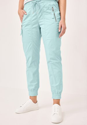 MIT KORDELZUG - Tracksuit bottoms - powder green