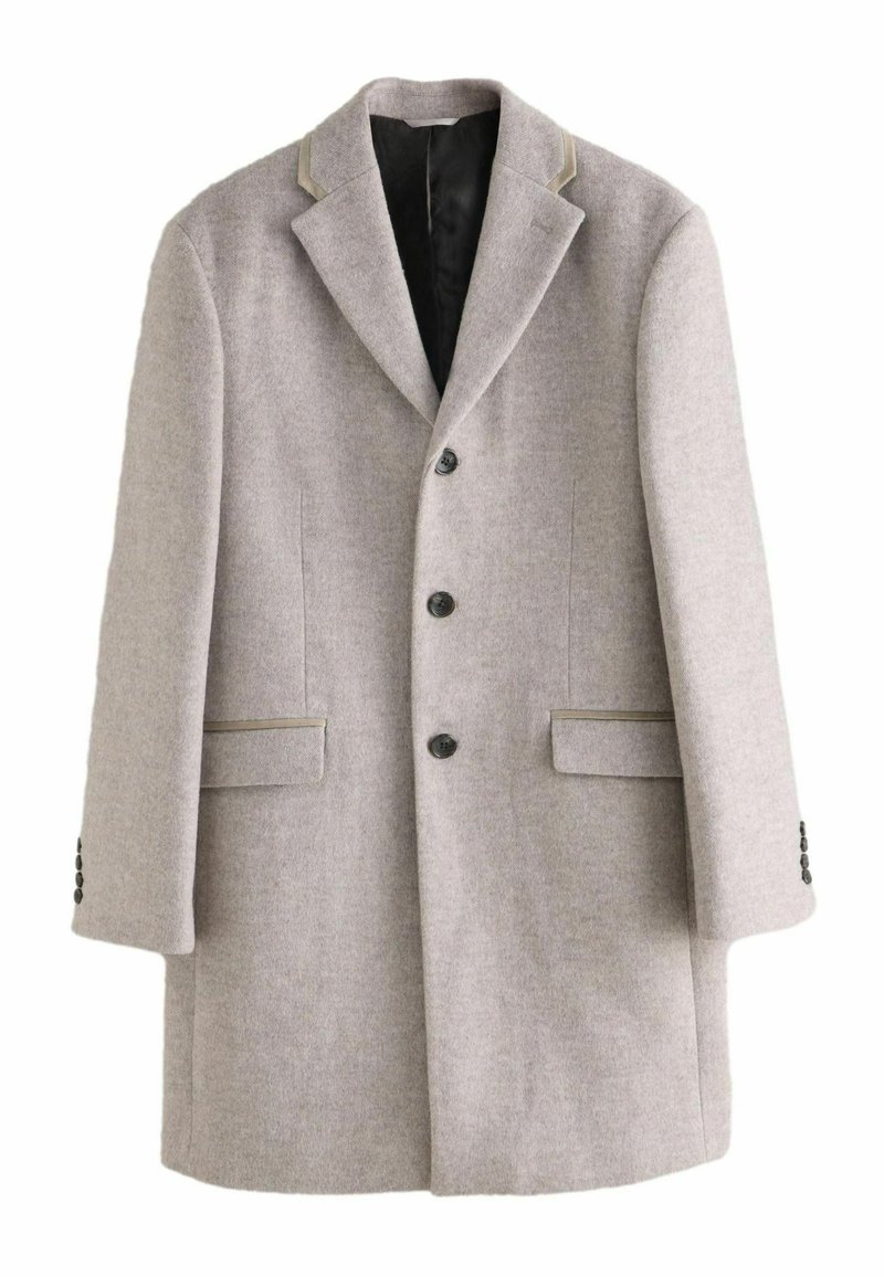 Lys grå uldblanding frakke med notch krave, fem knapper og to forlommer. Sorte accenter og tekstureret stofdetalje.