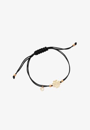 Czarny sznurkowy bransoletka z złotym kwiatowym charmsami i małą złotą koraliką akcentującą, z regulowanym zapięciem węzłowym dla możliwości dostosowania rozmiaru.