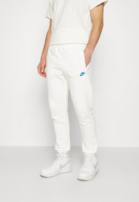 Nike Sportswear Tracksuit bottoms - off-white