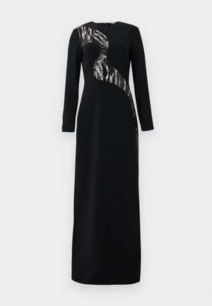 Black long-sleeve dress featuring a curved sequin panel on the upper left side, with a sleek, straight silhouette and minimalistic design.