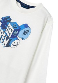 Felpa bianca con grafica blu, che include forme, il testo "ACTIVE", faccine sorridenti e "HI!" sulla parte anteriore. Tessuto morbido, vestibilità rilassata.