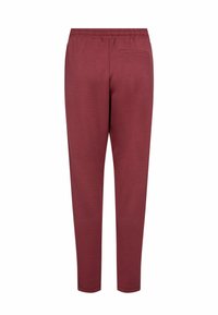 Bordowe spodnie dresowe z elastycznym pasem, dopasowanym krojem, miękkim bawełnianym materiałem oraz dyskretną tylną kieszenią.