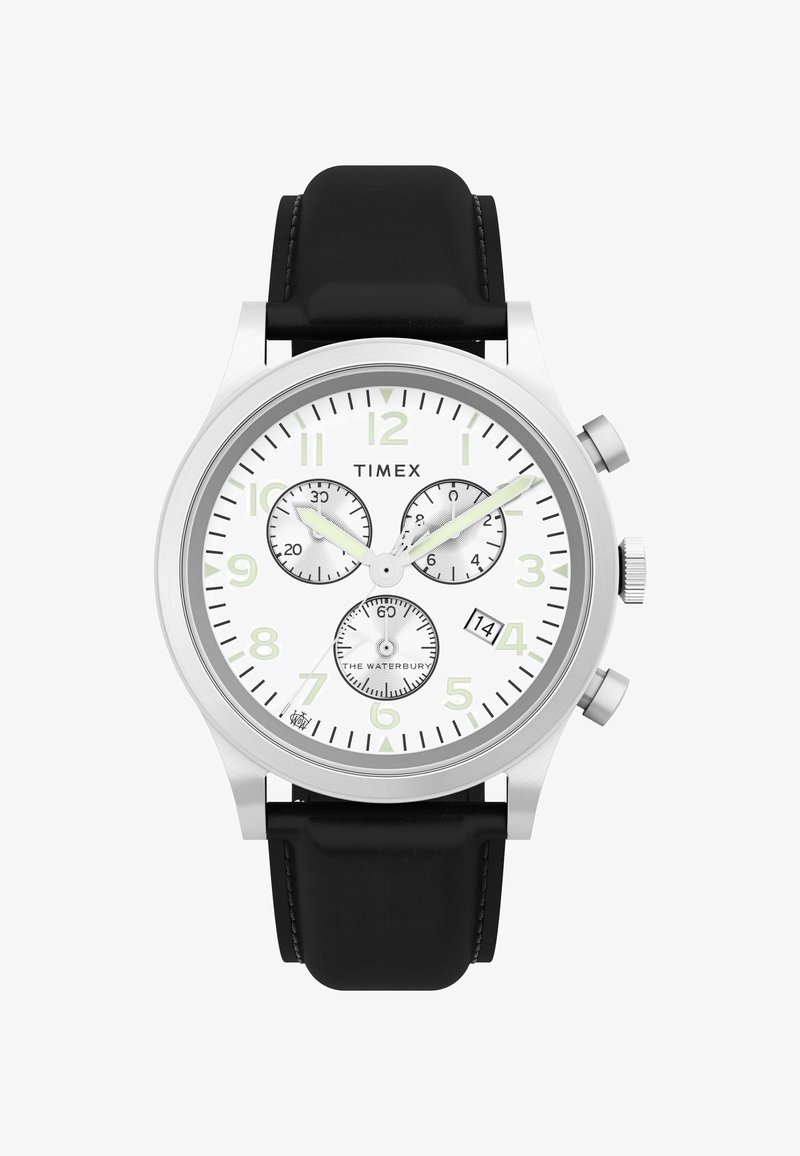 A Timex Waterbury óra ezüst rozsdamentes acél tok, fehér számlap, fekete bőrszíj, három kis számlap és dátum kijelző jellemzi.