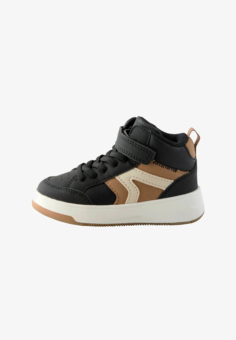 Black and tan high-top sneaker featuring a padded collar, Velcro strap, and rubber sole with a textured tread pattern.