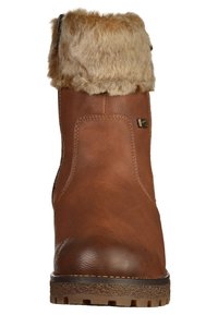 Botte d'hiver en cuir marron avec semelle en caoutchouc épaisse et revers en fausse fourrure marron clair replié sur le dessus.