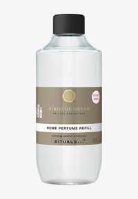 Przezroczysta szklana butelka z czarną nakrętką, oznaczona etykietą "Hibiskusowy Sen - Uzupełnienie Perfum do Domu." Złote i białe napisy; pojemność 13,5 fl oz.