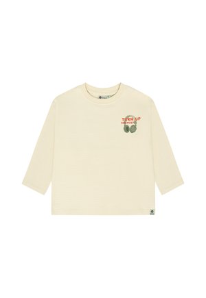 Beige langærmet skjorte med rund hals, lille grafik af hovedtelefoner og tekst "TURN UP THE MUSIC" på øverste venstre front.