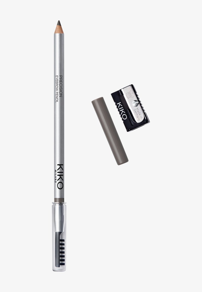 Crayon à sourcils argenté avec capuchon de brosse transparent, capuchon de crayon gris amovible, et taille-crayon en métal noir avec la marque "KIKO".