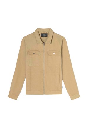 Veste beige en coton, dotée d'une fermeture éclair sur le devant, de deux poches poitrine avec des boutons-pression et d'un col.