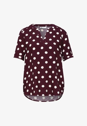 Blusa bordeaux a maniche corte con pois bianchi e scollo a V, con orlo curvo.
