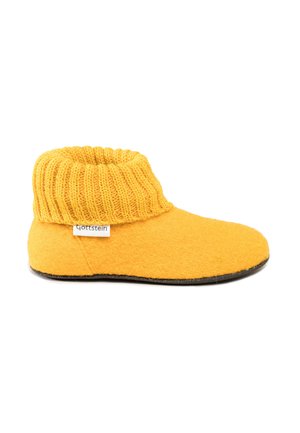 Yellow wool slipper with a knitted cuff. Soft texture, rounded toe, and flat black sole. Brand label visible on the side.