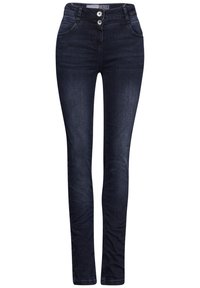 Jean skinny en denim bleu foncé avec une texture lisse, fermeture à deux boutons et design classique à cinq poches. Forme ajustée au niveau des jambes.