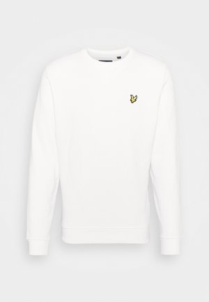 Sweatshirt blanc à manches longues, col rond, avec des poignets et un ourlet côtelés, présentant un petit logo jaune brodé sur la poitrine.