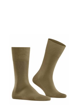 Chaussettes en mélange de coton olive avec des bords ribbed, une texture lisse, et une longueur standard, présentant un design simple et sans ornements.