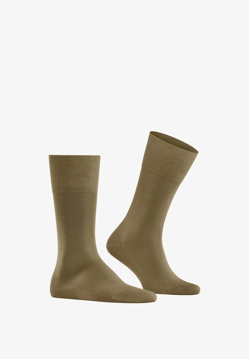 Chaussettes en mélange de coton olive avec des bords ribbed, une texture lisse, et une longueur standard, présentant un design simple et sans ornements.