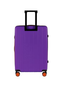 Hard-shell suitcase in purple with vertical ridges, black telescopic handle, and orange wheels. Includes a side handle for easy transport.