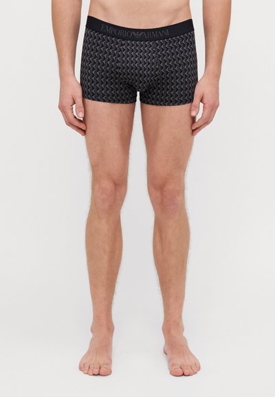 Black boxer briefs featuring a geometric pattern, soft elastic waistband with "Emporio Armani" logo, and snug fit design.