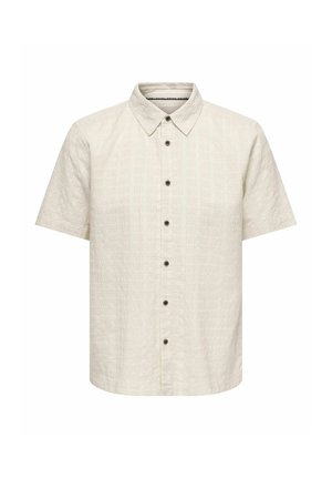 Chemise crème à manches courtes avec col à revers et six boutons noirs à l'avant, présentant un motif quadrillé texturé subtil.