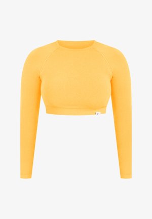 Langærmet crop top i lys gul bomuld med rund udskæring og ribbet kant. Glat tekstur, tætsiddende design og ingen synlige grafikker.